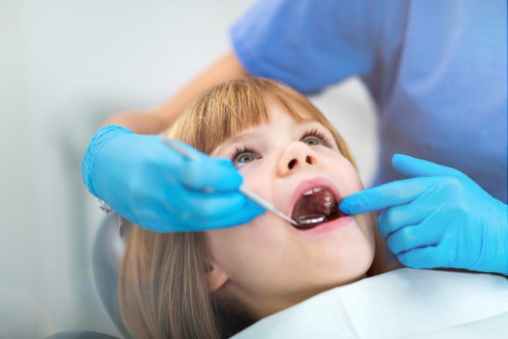Young girl having a dental exam