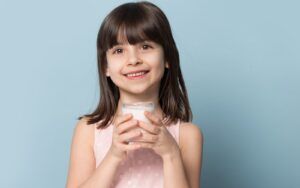 Smiling Child with Milk