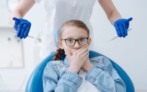 Child with Dental Anxiety at Dentist Office