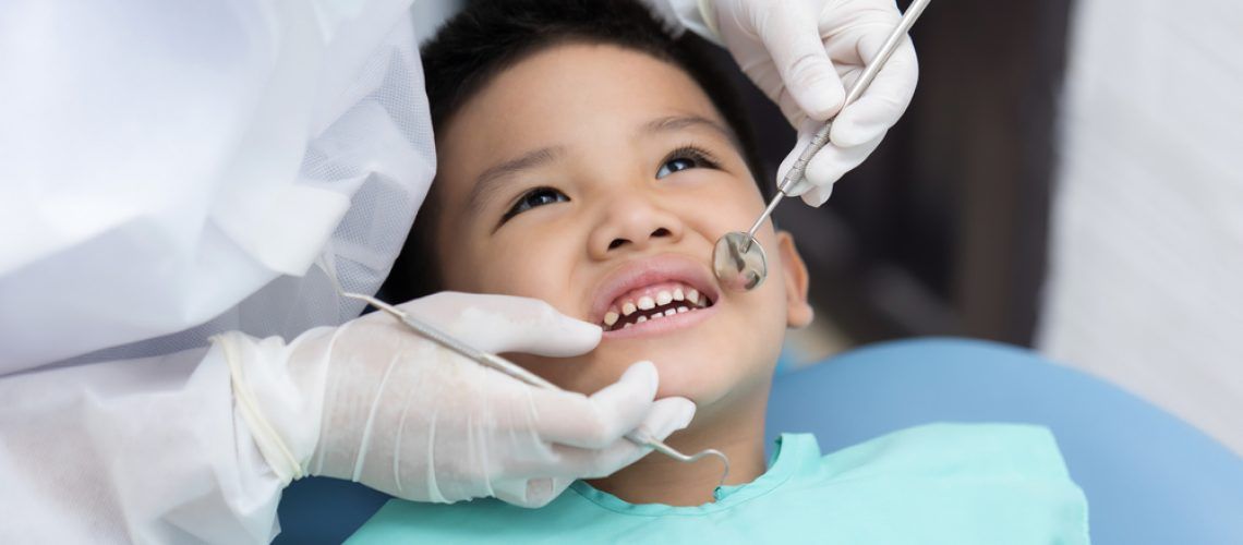 Dentist,Examining,Asian,Little,Boy,Teeth,In,Clinic.