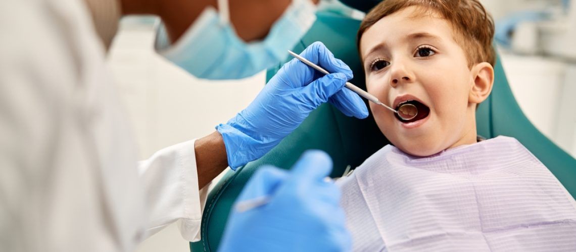 Small,Kid,Having,His,Teeth,Examined,By,Dentist,At,Dental