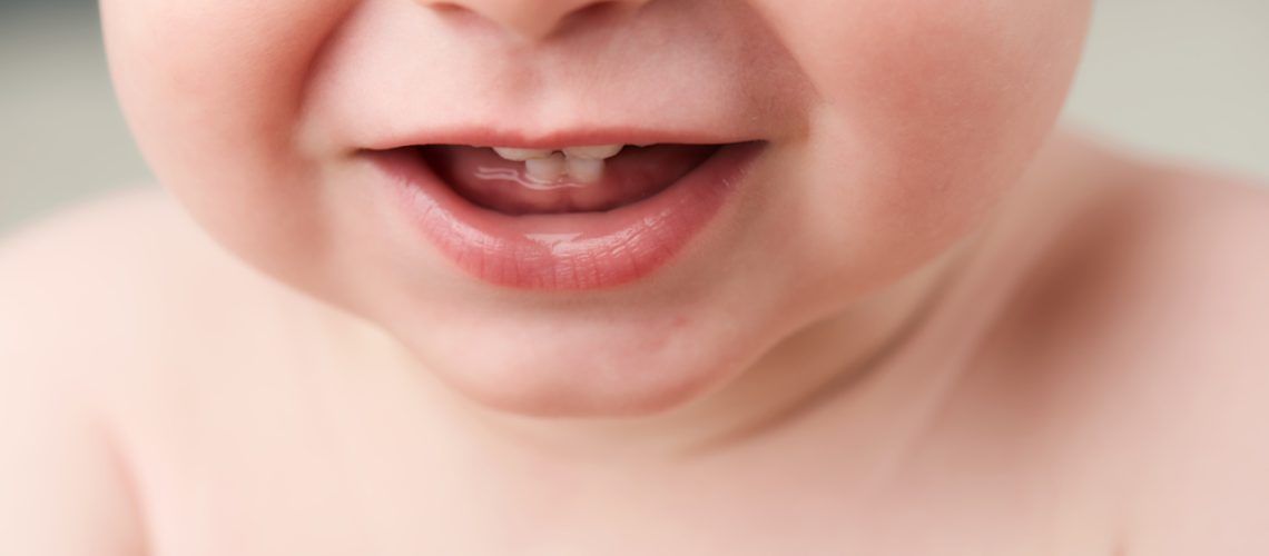 Cropped,Image,Of,A,Baby's,Mouth,Open,Showing,His,First
